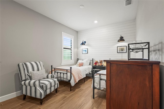16226 Hidden Oak Loop, Bradenton, FL 34211 - bedroom with wood finished floors, baseboards, wood walls, and recessed lighting