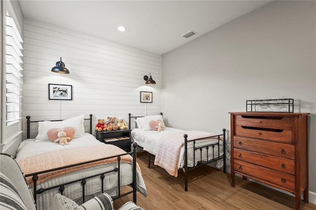 16226 Hidden Oak Loop, Bradenton, FL 34211 - bedroom featuring wooden walls, wood finished floors, and recessed lighting