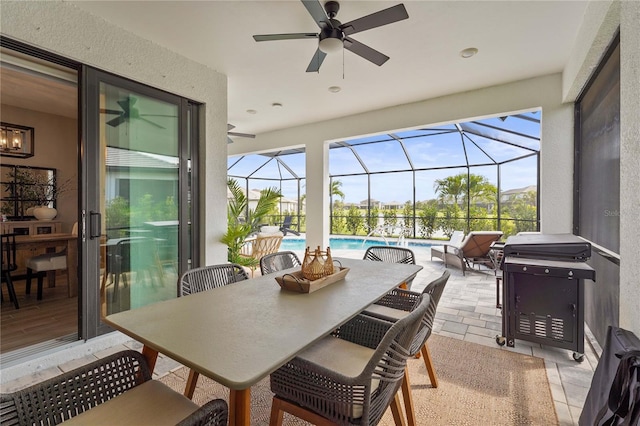 16226 Hidden Oak Loop, Bradenton, FL 34211 - sunroom with a ceiling fan, outdoor dining space, a swimming pool, and plenty of natural light