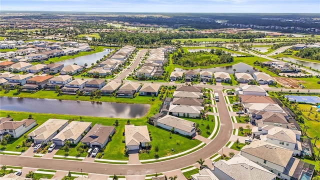 16226 Hidden Oak Loop, Bradenton, FL 34211 - aerial perspective of suburban area with a large body of water