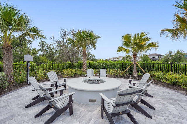 16226 Hidden Oak Loop, Bradenton, FL 34211 - fenced backyard featuring an outdoor fire pit and a patio