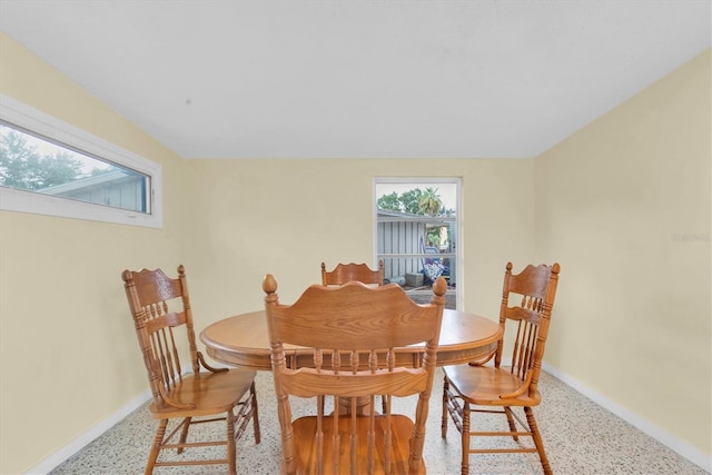 6628 Auburn Ave, Bradenton, FL 34207 - dining space with speckle patterned floor and baseboards