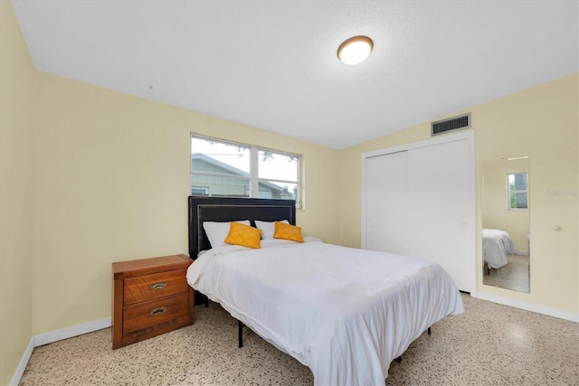 6628 Auburn Ave, Bradenton, FL 34207 - bedroom with baseboards, dark aggregate flooring, and multiple windows