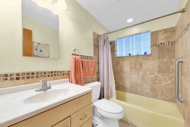 6628 Auburn Ave, Bradenton, FL 34207 - bathroom featuring shower / bath combo, toilet, vanity, and tile walls