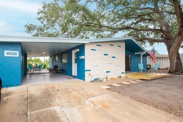 6628 Auburn Ave, Bradenton, FL 34207 - view of property exterior with a deck and an attached carport