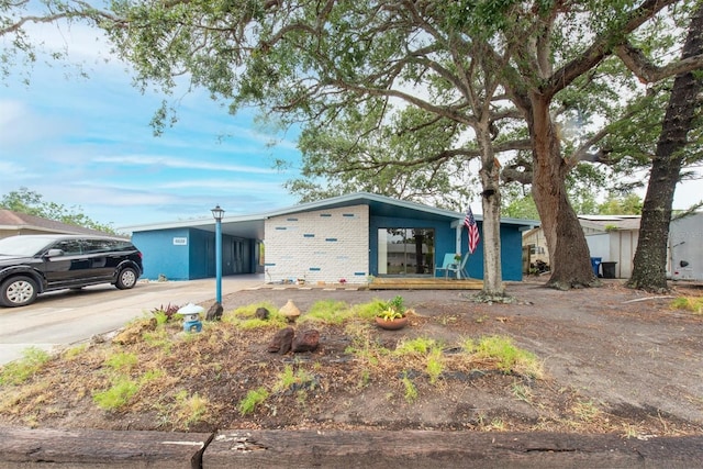 6628 Auburn Ave, Bradenton, FL 34207 - view of front of property featuring driveway, an attached carport, and brick siding