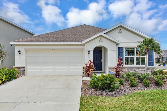 view of front of home featuring stone siding, stucco siding, driveway, a garage, and a shingled roof