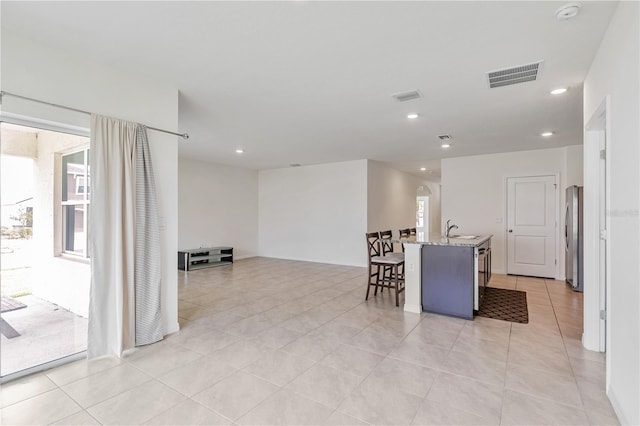 dining area featuring recessed lighting and light tile patterned floors
