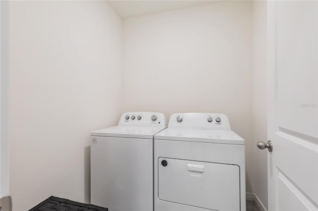 laundry area with washing machine and clothes dryer