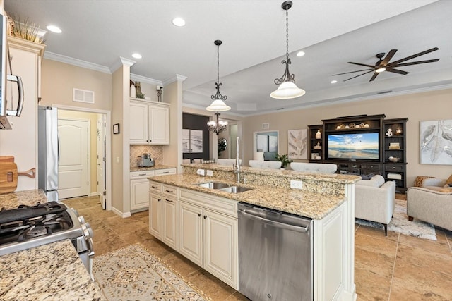 11508 Griffith Park Ter, Bradenton, FL 34211 - kitchen featuring stainless steel appliances, a sink, crown molding, open floor plan, and recessed lighting