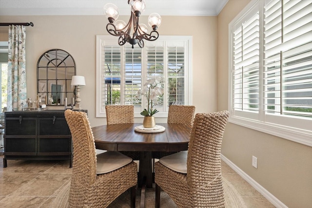 11508 Griffith Park Ter, Bradenton, FL 34211 - dining room featuring a chandelier, crown molding, and baseboards