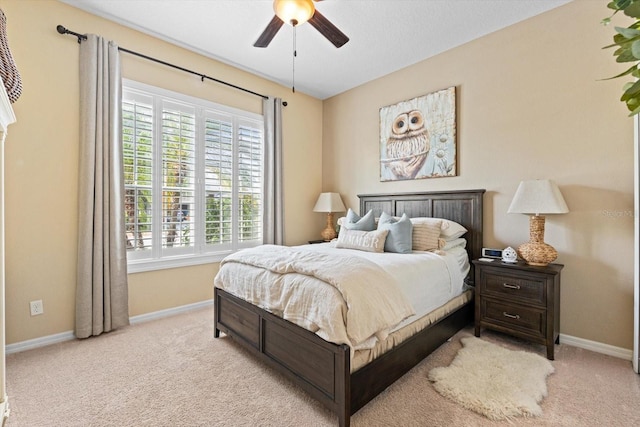 11508 Griffith Park Ter, Bradenton, FL 34211 - bedroom featuring baseboards, light colored carpet, and a ceiling fan