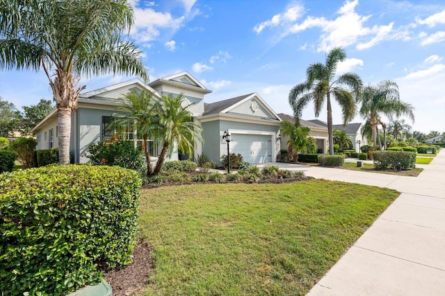 11508 Griffith Park Ter, Bradenton, FL 34211 - ranch-style home with stucco siding, concrete driveway, an attached garage, and a front lawn