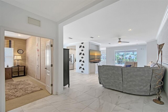 5320 Tide Point Way, Bradenton, FL 34208 - living room with light marble finish flooring, ceiling fan, recessed lighting, and ornamental molding