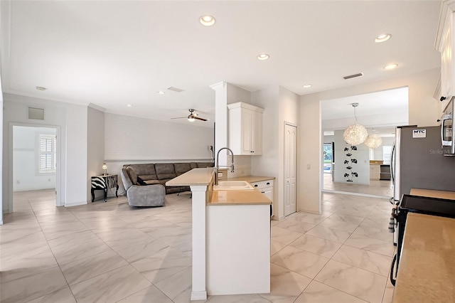 5320 Tide Point Way, Bradenton, FL 34208 - kitchen featuring a sink, open floor plan, plenty of natural light, a peninsula, and recessed lighting