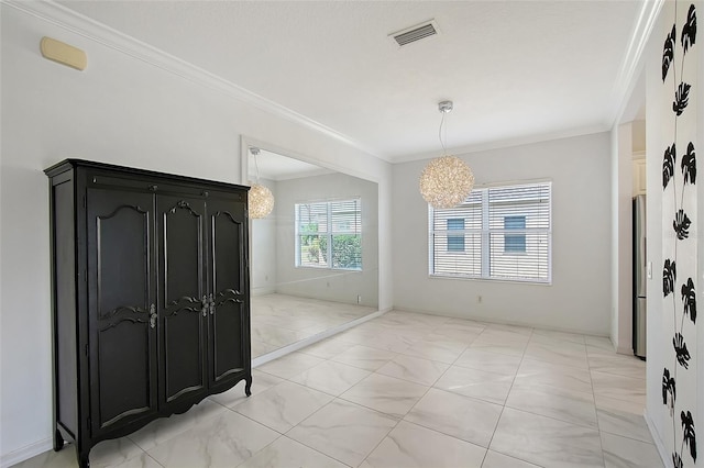 5320 Tide Point Way, Bradenton, FL 34208 - foyer entrance with light marble finish flooring, ornamental molding, and a chandelier