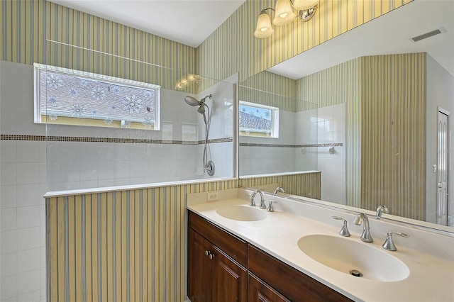 5320 Tide Point Way, Bradenton, FL 34208 - bathroom featuring double vanity, a walk in shower, and wallpapered walls