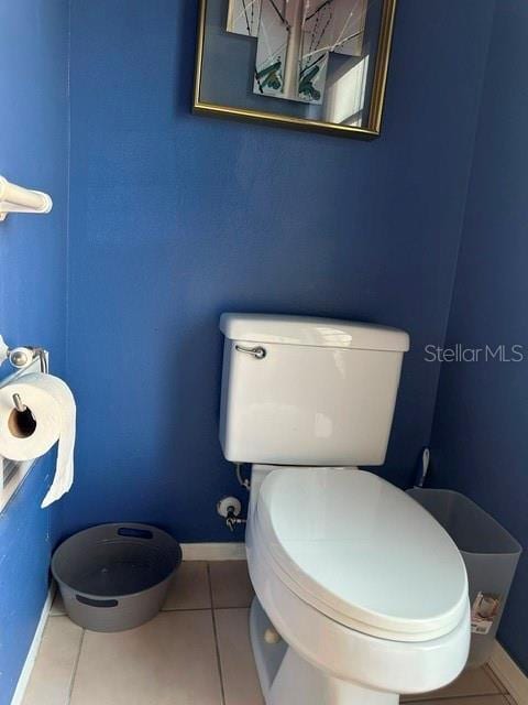 2181 Pine Gardens Trl, Sarasota, FL 34231 - bathroom featuring toilet, tile patterned floors, and baseboards