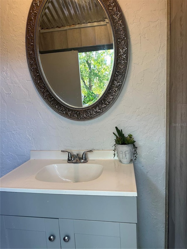 2181 Pine Gardens Trl, Sarasota, FL 34231 - bathroom with vanity and a textured wall