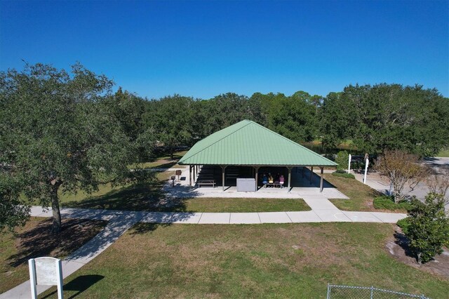 6470 Indigo Bunting Pl, Lakewood Ranch, FL 34202 - back of property with a yard and a wooded view