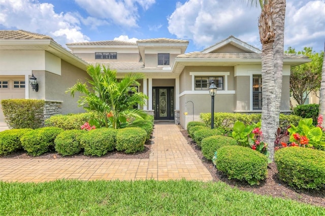 6470 Indigo Bunting Pl, Lakewood Ranch, FL 34202 - view of front facade with stucco siding