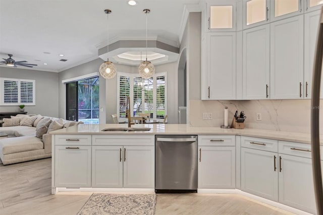 6470 Indigo Bunting Pl, Lakewood Ranch, FL 34202 - kitchen featuring dishwasher, crown molding, open floor plan, a peninsula, and white cabinetry