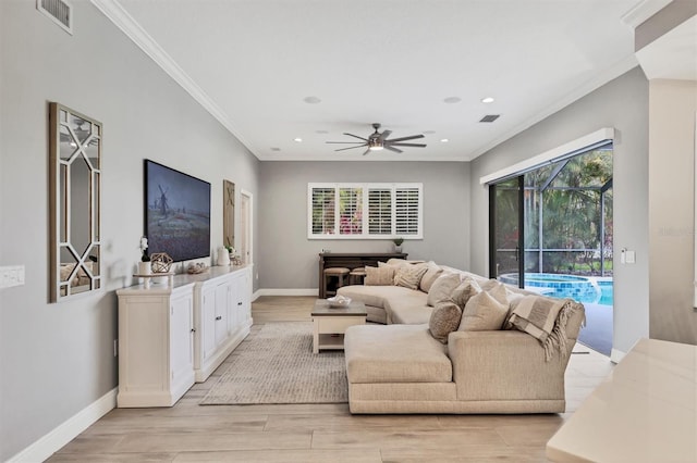 6470 Indigo Bunting Pl, Lakewood Ranch, FL 34202 - living area featuring ornamental molding, ceiling fan, light wood-style floors, and recessed lighting