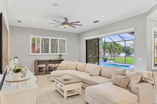 6470 Indigo Bunting Pl, Lakewood Ranch, FL 34202 - living area featuring a ceiling fan, a sunroom, recessed lighting, and crown molding