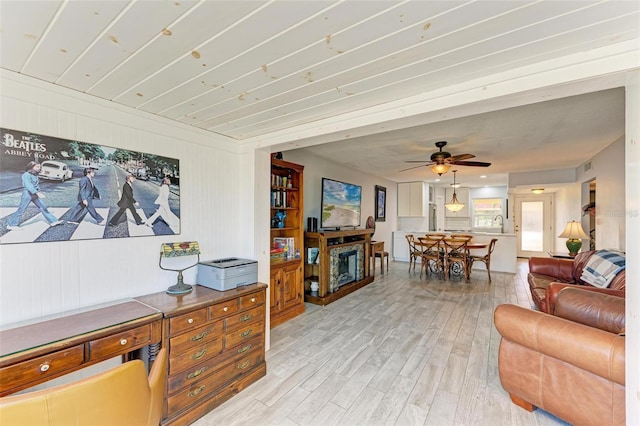 9409 Catalina Dr, Bradenton, FL 34210 - living area with light wood-style floors and ceiling fan
