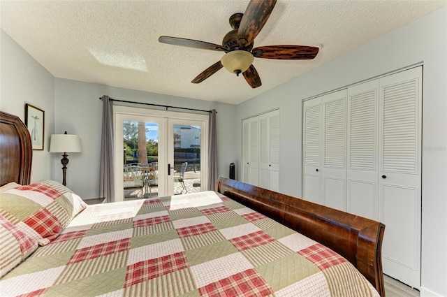 9409 Catalina Dr, Bradenton, FL 34210 - bedroom with french doors, access to exterior, two closets, a textured ceiling, and ceiling fan