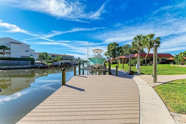 9409 Catalina Dr, Bradenton, FL 34210 - dock area featuring boat lift, a lawn, and a water view