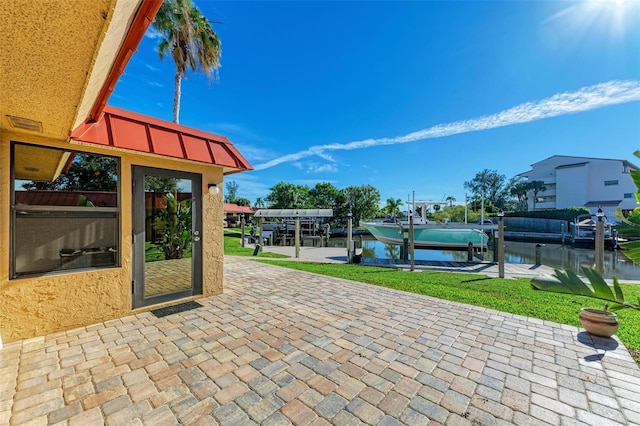 9409 Catalina Dr, Bradenton, FL 34210 - view of patio featuring boat lift, a water view, and a boat dock