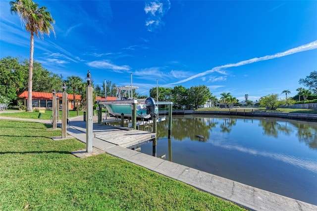 9409 Catalina Dr, Bradenton, FL 34210 - dock with boat lift, a water view, and a lawn