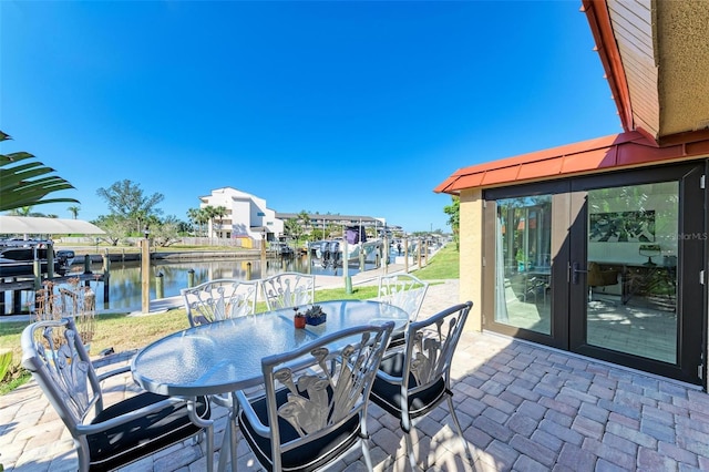 9409 Catalina Dr, Bradenton, FL 34210 - view of patio / terrace featuring a water view and outdoor dining space
