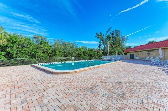 9409 Catalina Dr, Bradenton, FL 34210 - community pool featuring a patio area and fence