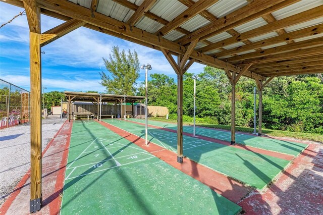 9409 Catalina Dr, Bradenton, FL 34210 - surrounding community with shuffleboard and fence
