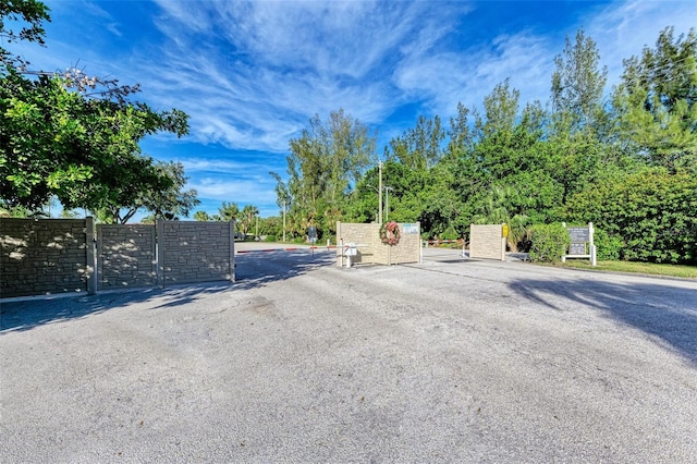9409 Catalina Dr, Bradenton, FL 34210 - view of asphalt street featuring a gated entry