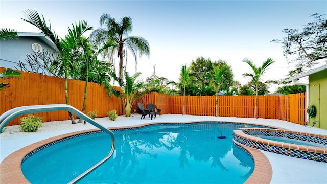 1010 68th St NW, Bradenton, FL 34209 - view of pool with a fenced backyard, a patio, and a pool with connected hot tub