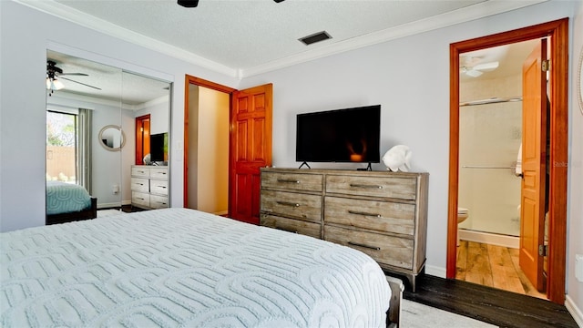 1010 68th St NW, Bradenton, FL 34209 - bedroom featuring wood finished floors, crown molding, a textured ceiling, a ceiling fan, and connected bathroom