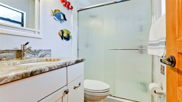 1010 68th St NW, Bradenton, FL 34209 - full bathroom featuring a stall shower, vanity, and toilet