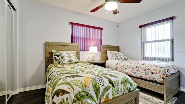 1010 68th St NW, Bradenton, FL 34209 - bedroom with wood finished floors, baseboards, a ceiling fan, and a closet