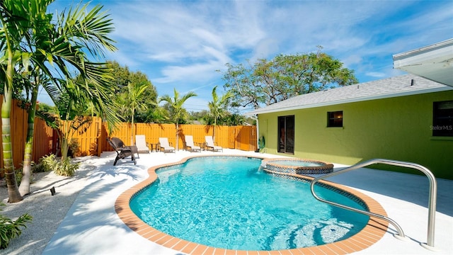 1010 68th St NW, Bradenton, FL 34209 - view of swimming pool with a patio area, a fenced backyard, and a pool with connected hot tub