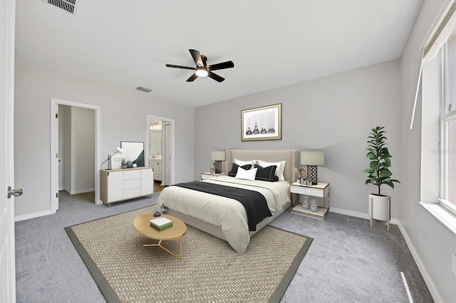 bedroom with light colored carpet, baseboards, and a ceiling fan