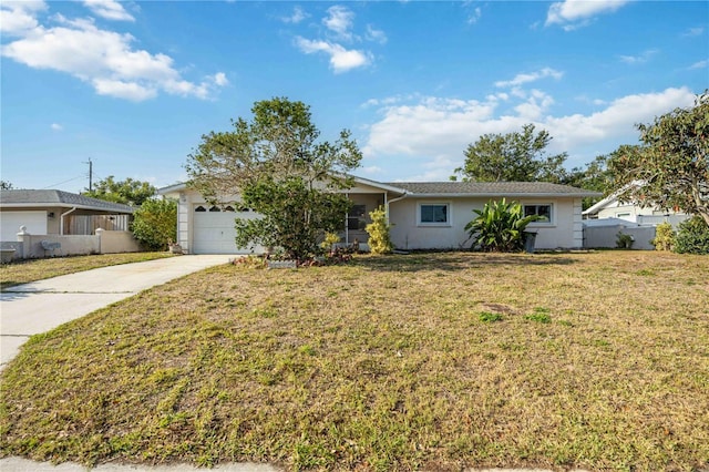 ranch-style house featuring concrete driveway, an attached garage, a front lawn, and fence