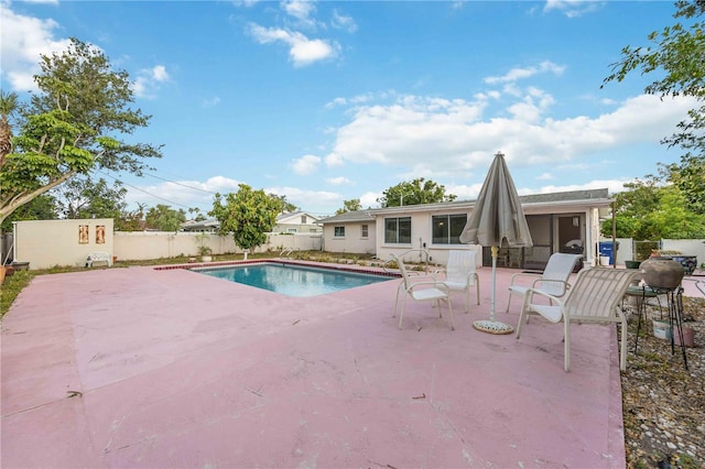 view of pool with a patio area and a fenced backyard