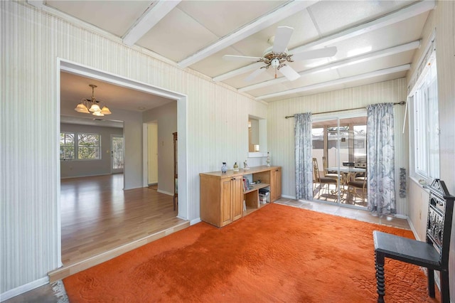 office space featuring baseboards, beamed ceiling, ceiling fan with notable chandelier, and wood finished floors