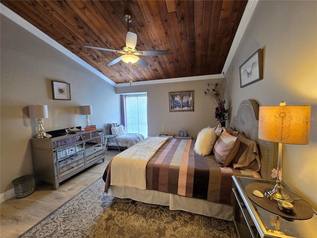 bedroom featuring ornamental molding, wood ceiling, wood finished floors, vaulted ceiling, and baseboards