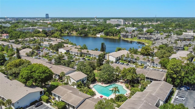 bird's eye view of a pool area and a nearby body of water