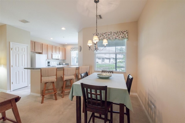 4103 Foristall Ave Unit 4103, Sarasota, FL 34233 - dining area with light colored carpet, a chandelier, baseboards, and recessed lighting