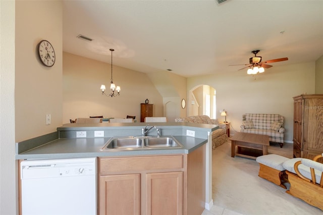4103 Foristall Ave Unit 4103, Sarasota, FL 34233 - kitchen with white dishwasher, a sink, open floor plan, arched walkways, and a peninsula